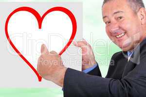 Man holding and pointing at sign with heart