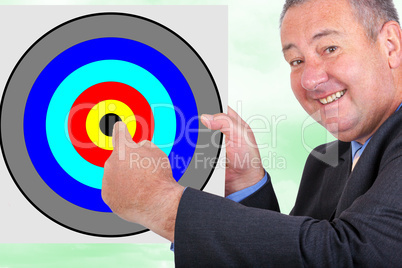 Man holding and pointing at sign with target