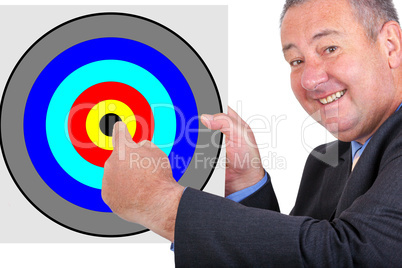 Man holding and pointing at sign with target