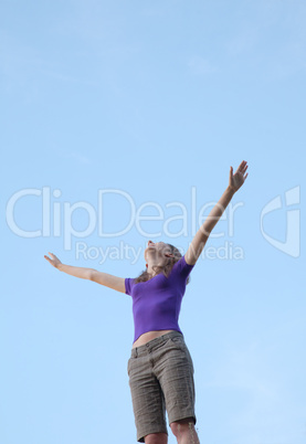 Young woman standing with raised hand