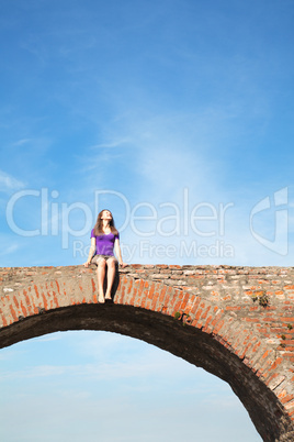 Young woman sitting outdoors