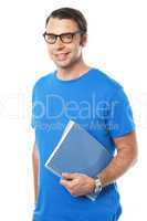 Casual young guy holding notepad