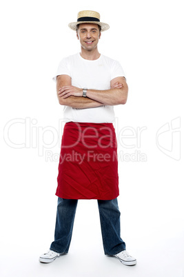 Stylish chap wearing hat. Apron tied on his waist