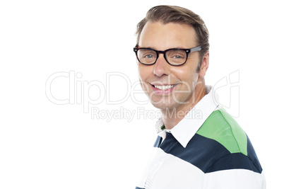 Cheerful young casual guy looking at you