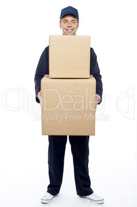 Young relocation staff member holding cardboard boxes