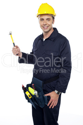 Repairman holding out hammer from his tool kit