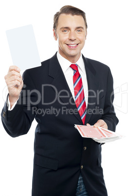 Executive showing blank playing card to camera