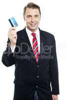An entrepreneur showing debit card to camera