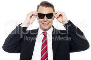 Stylish handsome businessman wearing shades