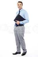 Handsome confident businessperson holding file folder