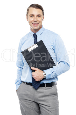 Handsome smiling executive holding clipboard