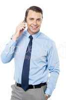 Business executive communicating over cellphone