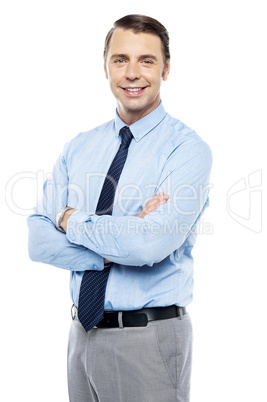 Smiling business representative posing, arms folded