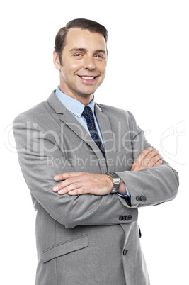 Male consultant smiling with his arms crossed