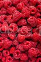 Ripe rasberry fruit horizontal close up background.