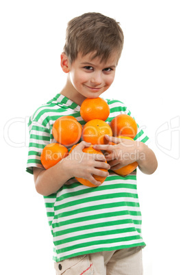 Boy holding oranges