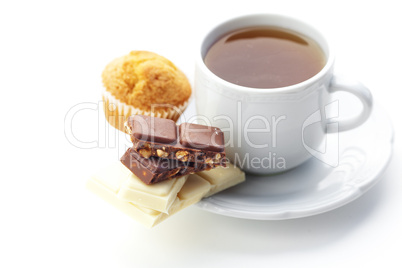 bar of chocolate,tea and muffin isolated on white