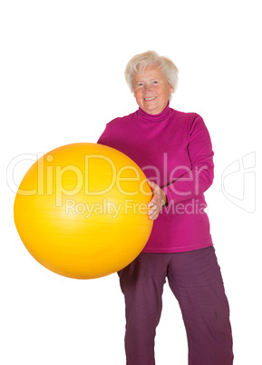 Happy retired woman holding gym ball