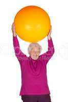 Senior woman exercising with gym ball