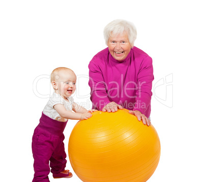 Grandmother and baby with pilatses ball