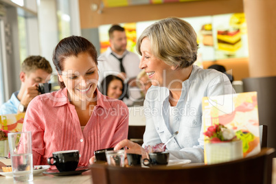 Mother and daughter relaxing in a cafe