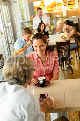 Senior woman with her daughter at cafe