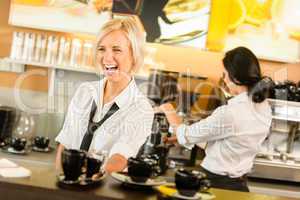 Waitress serving coffee cups making espresso woman