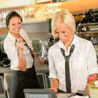 Cafe waitress cashes in order bill register