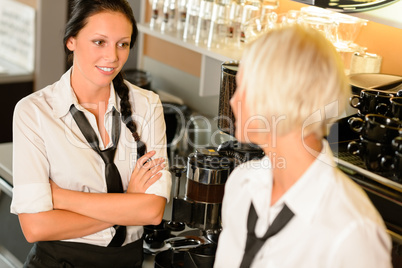 Waitresses talking gossiping in break cafe women