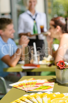 Menus at cafe bar restaurant terrace people