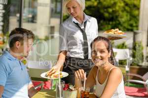 Waitress bring couple lunch food restaurant terrace