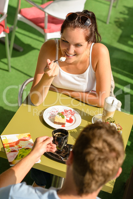 Couple enjoy coffee dessert restaurant terrace