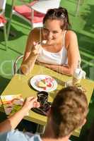 Couple enjoy coffee dessert restaurant terrace