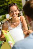 Smiling woman at restaurant terrace couple lunch