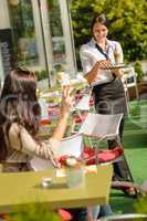 Waitress bringing woman coffee order restaurant