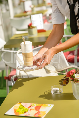 Waitress hands close up serving latte cafe