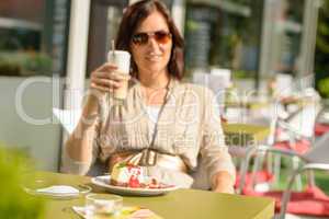 Woman drinking latte at cafe bar dessert