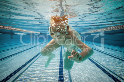 Boy swimming under water