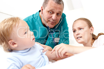 Doctor listen the baby with stethoscope.