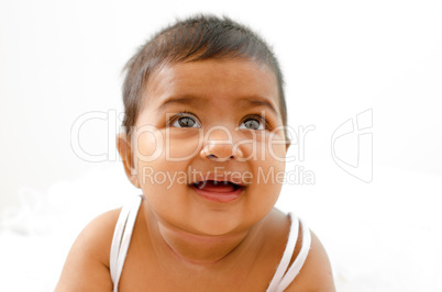 Indian baby girl looking up