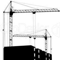 Silhouette of two cranes working on the building