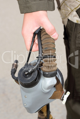 Uniforms, oxygen mask in his hand a military pilot