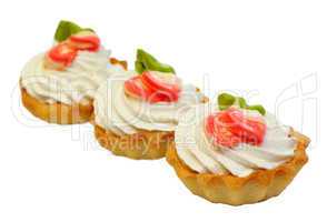 sweet cake with cream isolated on white