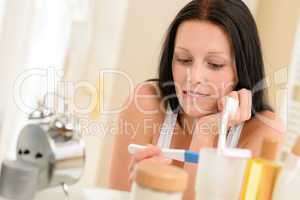 Woman expecting pregnancy test result in bathroom