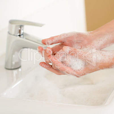 Soap handwash close-up above bathroom sink