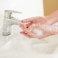 Soap handwash close-up above bathroom sink