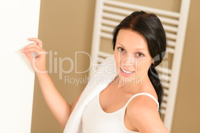 Beautiful woman in bathroom with towel