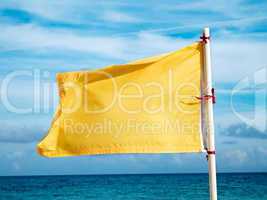 yellow flag on the sea