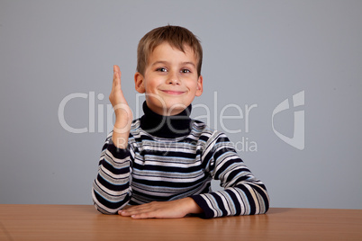 Cheerful Schoolboy ready to answer question