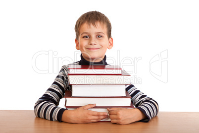 Schoolboy and a heap of books isolated on a white background